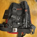 Hollis Elite Travel System Md/lg - Aluminum Backplate And Wing 22LB Lift Bc. Fixed Price $809.95.