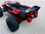 Mini Kraton 3S Wing Mount And Wheelie Bar. Fixed Price $23.00.